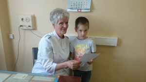 Раиса Филиппова с юным пациентом